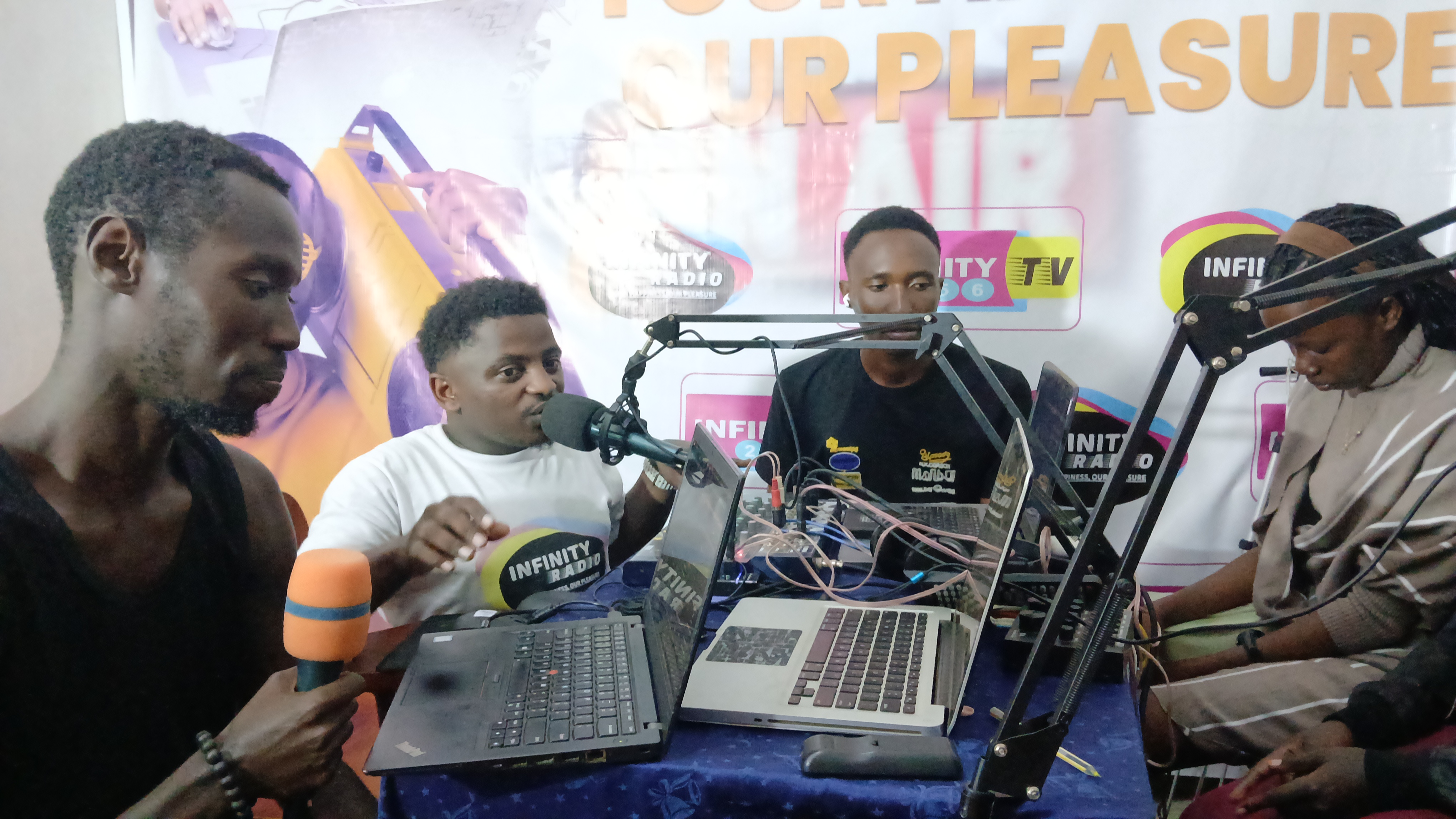 On air at Infinity Radio with the studio team
